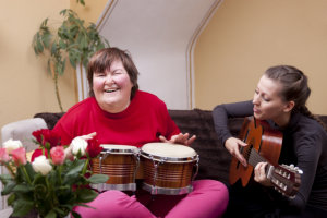 young woman with mental disorder having a music therapy